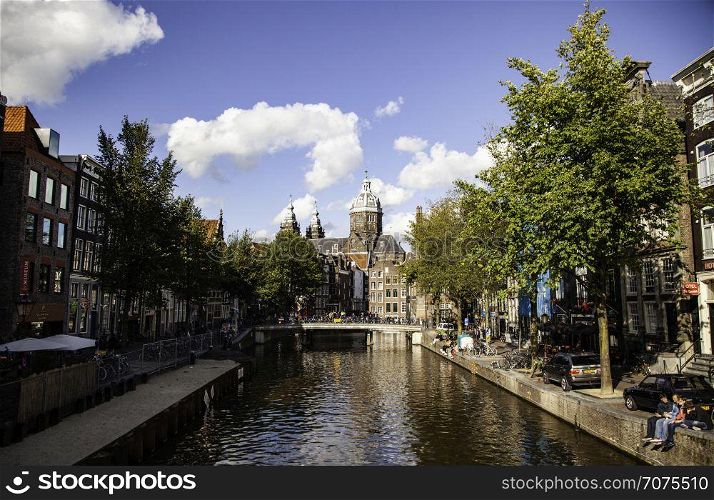 AMSTERDAM, NETHERLAND - SEPTEMBER 07, 2018, Typical houses and water channels is one of the architectural attractions of the city, Netherland on September 07, 2018