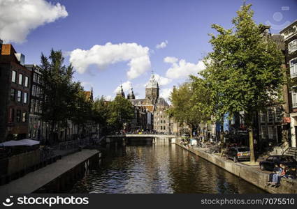 AMSTERDAM, NETHERLAND - SEPTEMBER 07, 2018, Typical houses and water channels is one of the architectural attractions of the city, Netherland on September 07, 2018