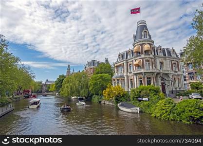 Amsterdam, Netherlands - May 16, 2019: Dutch house with the Amsterdam flag honoring the national championship from Ajax in Amsterdam the Netherlands