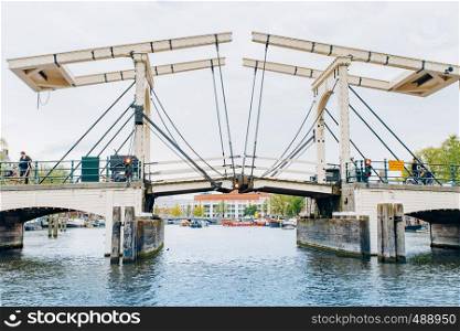 Amsterdam, Netherlands September 5, 2017: Magere Brug Bridge and Amstel river.