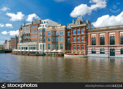 Amsterdam. Old city canal.. Traditional dutch houses on the canal. Amsterdam. Netherlands