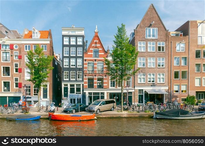 Amsterdam. Old city canal.. Traditional dutch houses on the canal. Amsterdam. Netherlands