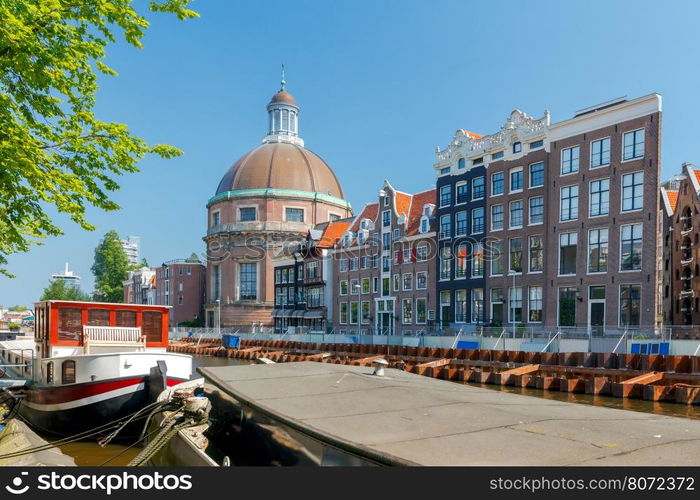 Amsterdam. Old city canal.. Traditional dutch houses on the canal. Amsterdam. Netherlands