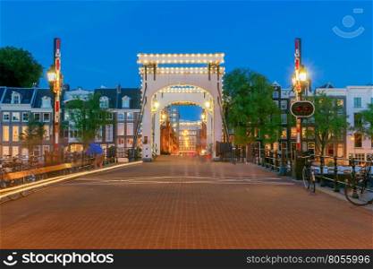Amsterdam. Skinny Bridge.. The Skinny Bridge Magere Brug at night. Amsterdam. Netherlands.