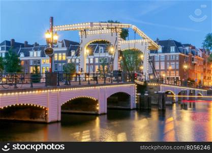 Amsterdam. Skinny Bridge.. The Skinny Bridge Magere Brug at night. Amsterdam. Netherlands.