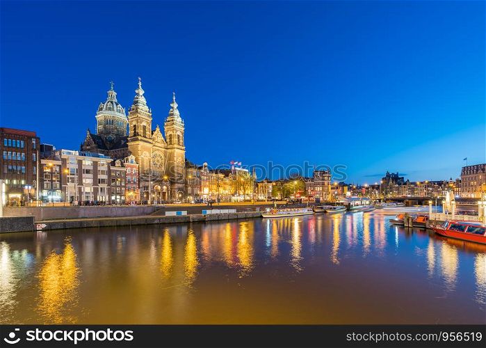 Amsterdam skyline with landmark buidings and canal in Amsterdam city, Netherlands.