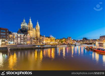 Amsterdam skyline with landmark buidings and canal in Amsterdam city, Netherlands.