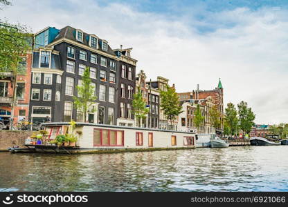 Amsterdam, the Netherlands, September 5, 2017 : Canal in Amsterdam in a beautiful summer day