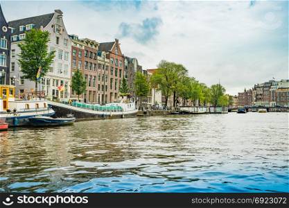 Amsterdam, the Netherlands, September 5, 2017 : Canal in Amsterdam in a beautiful summer day