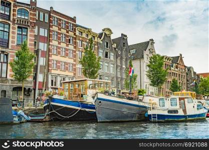 Amsterdam, the Netherlands, September 5, 2017 :typical dutch houses and houseboats. Amsterdam, Holland, Netherlands