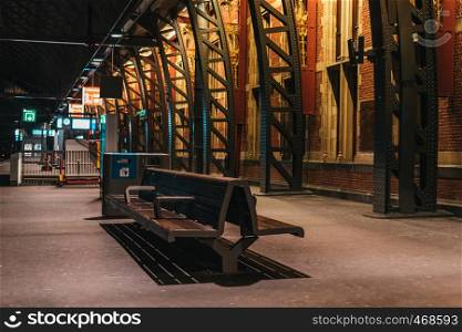 Amsterdam train station interior with warm light