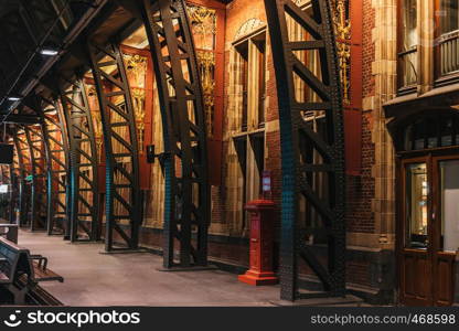 Amsterdam train station interior with warm light