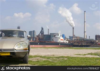 An 1973 Citroen DS contrasting with the steel works in the rear.