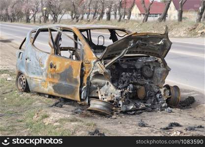 An abandoned, stolen burnt out car