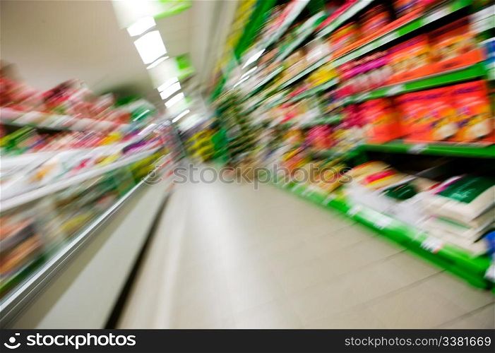 An abstract blur of a grocery store aisle.