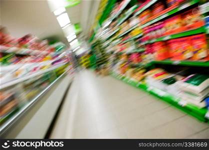 An abstract blur of a grocery store aisle.