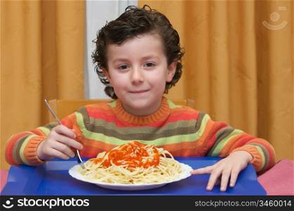 An adorable child eating in his house