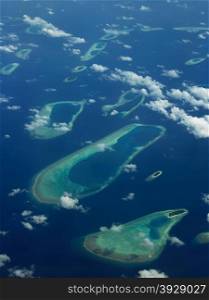 An aerial view of some of the coral atoll of the Maldives in the Indian Ocean.