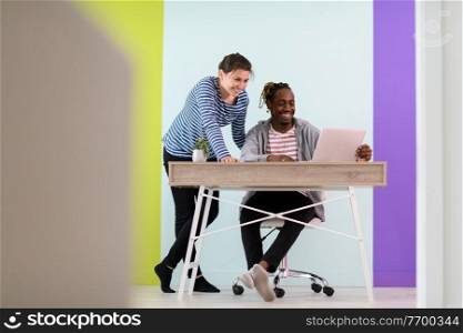 an african american and a young girl plan meetings together and use a laptop for an online meeting 