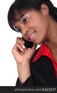 An African American businesswoman over the phone.