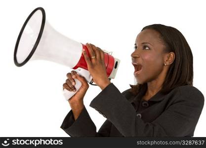 An African American businesswoman shouting through a megaphone