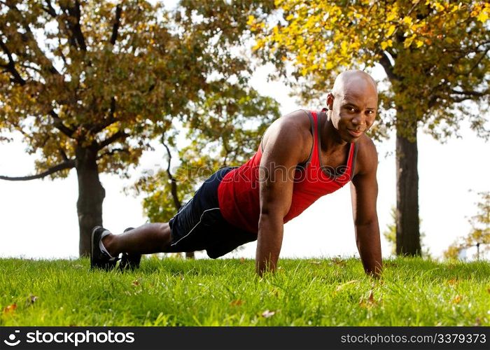 An african american doing exercises in the park