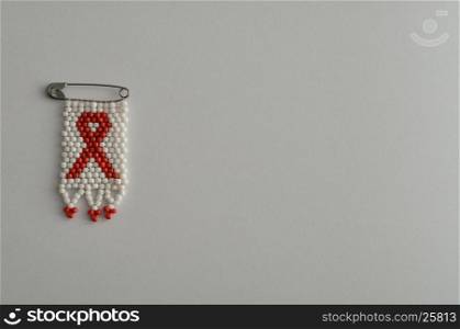 An aids ribbon as a bead work pin isolated