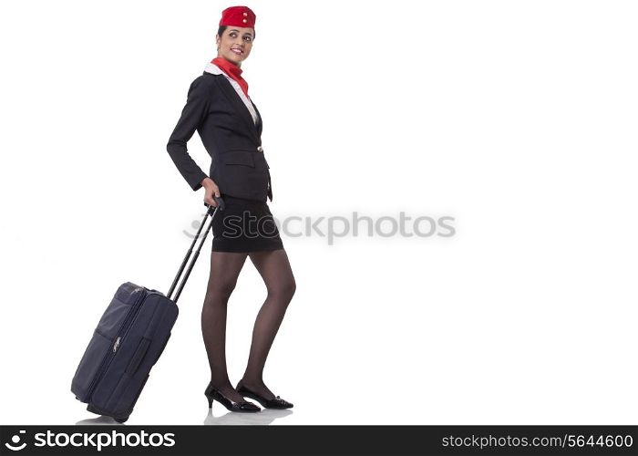 An airhostess with luggage bag isolated over white background