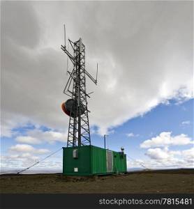 An all weather communications tower in the geographical center of Iceland, build on top of a dormant shield volcano, the Fjordungsalda