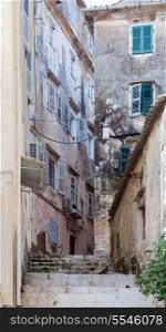 An alley full of once majestic but now crumbling and dilapidated buildings dating from the Venetian era.