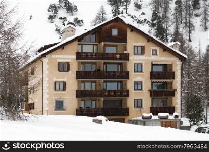 An alpine hotel, in a a snow-covered region of western Switzerland