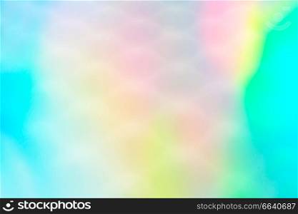 An amazing and vibrant macro of iridescent surface with scale texture as background