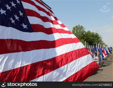 An American flag flies while in a parade