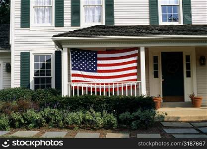 An American flag is displayed on a porch, Bermuda