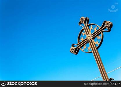 An ancient iron cross on the sky