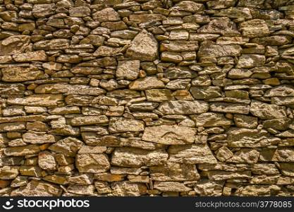 An ancient stone wall used for terracing near Nonza on Cap Corse in Corsica