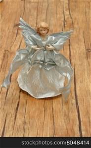 An angel dressed in silver for decorating a Christmas tree