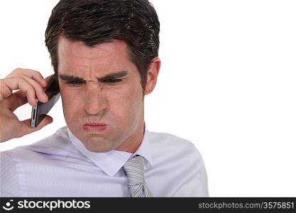 An angry businessman over the phone.