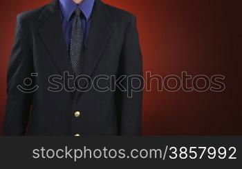 An anonymous businessman in a suit holds up a sign made of cardboard which says help, then flips it over and it says &#8220;Spare Change?&#8221;. Centered version also available.