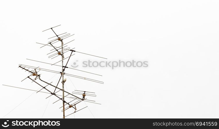 An antenna in the cloudy day with white cloud in the background.