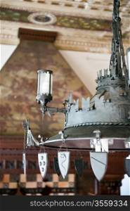 an antique chandelier CoppedA? in a historic castle