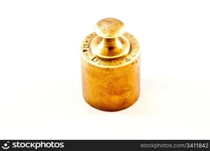 An antique iron weight on white background, useful for conceptual