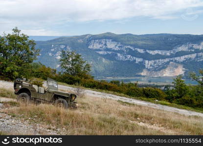 an antique military vehicle in the mountain