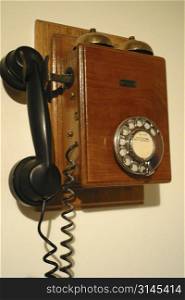 An antique telephone, Old wood grain.