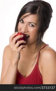An Apple a Day Woman Bites into Red Delicious Food Fruit Apple. Beautiful Brunette with RED Apple