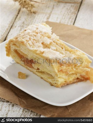 An Apple Strudel In A White Dish