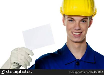 an apprentice / trainee. construction workers on site with a helmet.