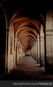 An arched passageway building in the town of Lucca, Italy.