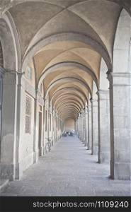 An arched passageway building in the town of Lucca, Italy.