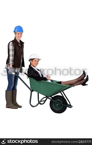 An architect getting a wheelbarrow ride.
